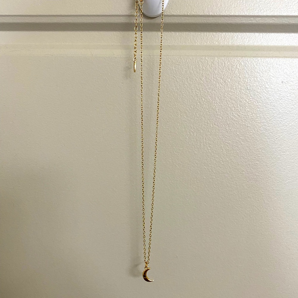 Kris Nations gold moon necklace. Dainty with black onyx detail.